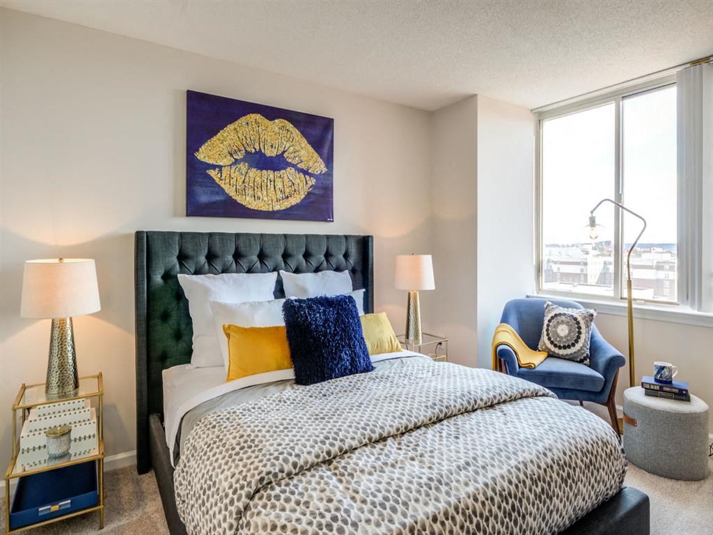 a bedroom with a bed and a large window at Lincoln Old Town, Alexandria, VA