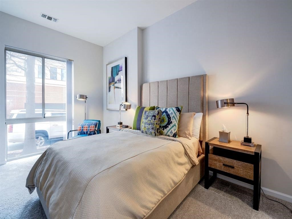 a bedroom with a large bed and a window at Lincoln Old Town, Alexandria, VA 22314