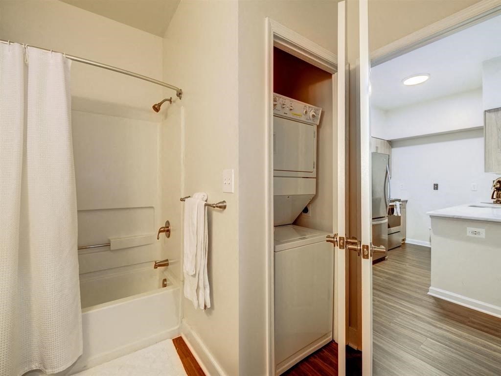 a bathroom with a shower and a tub and a sink at Lincoln Old Town, Virginia, 22314