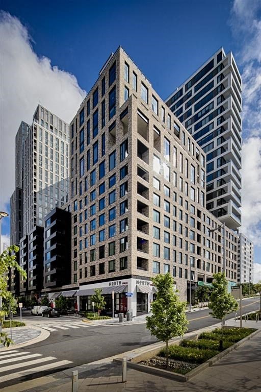 a tall building with a street in front of it at The Boro, Tysons Virginia