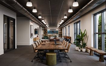 a large conference room with tables and chairs and large windows at La Unión, Tampa, FL