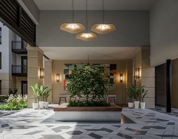 a lobby with a tree in the middle of it