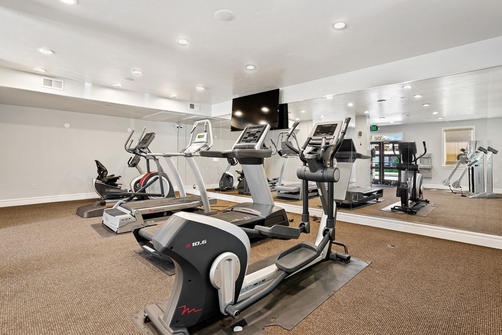 A gym with treadmills and elliptical machines.at Florentine Villas, Utah, 84047
