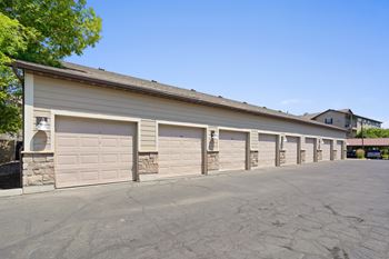 A long building with multiple garage doors.