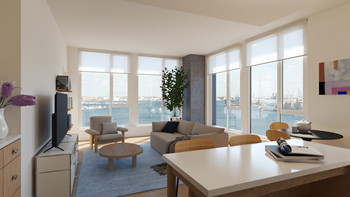 living room with a view of the water and a couch  at Allied Harbor Point, Baltimore, MD, 21231
