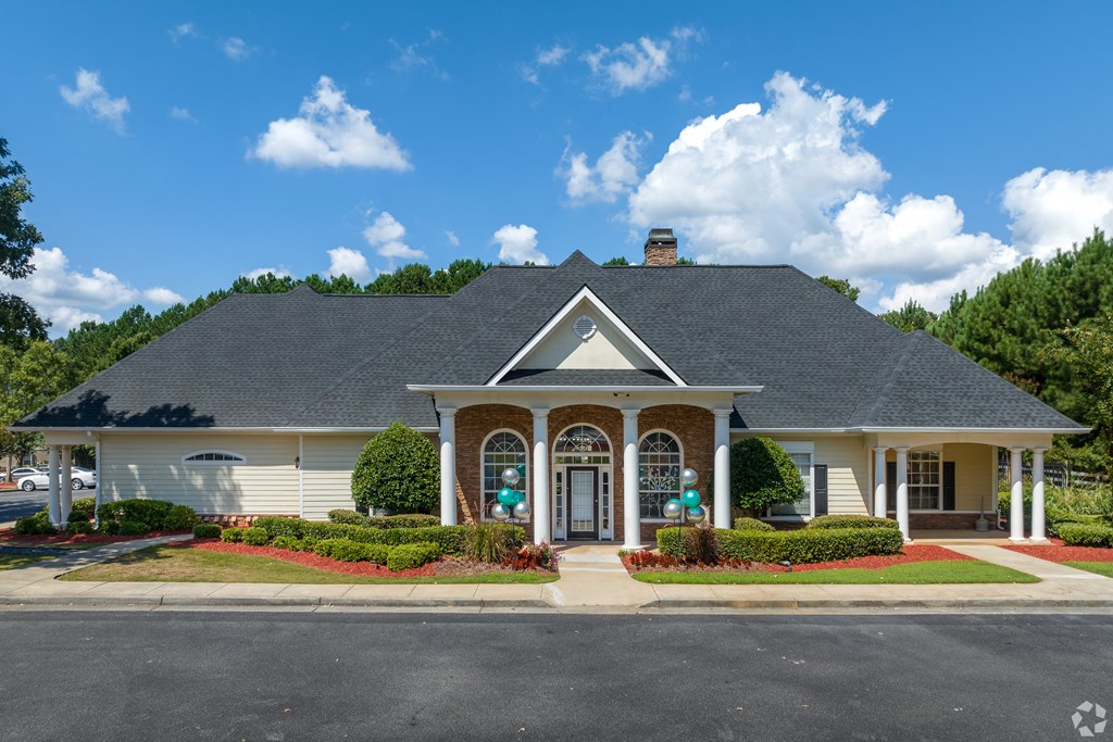 a large white house with a porch and a driveway at Alexander Ridge Apartments, Canton , GA 30114