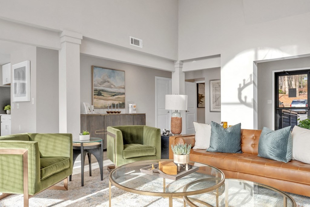 a living room with a couch and chairs and a glass coffee table  at Brampton Moors, North Carolina, 27513