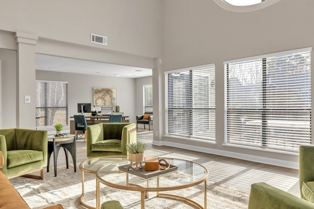a living room with large windows and a glass coffee table  at Brampton Moors, Cary, NC, 27513