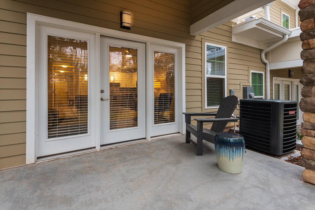 A Patio With a White Door at The Aster Apartments, Cary