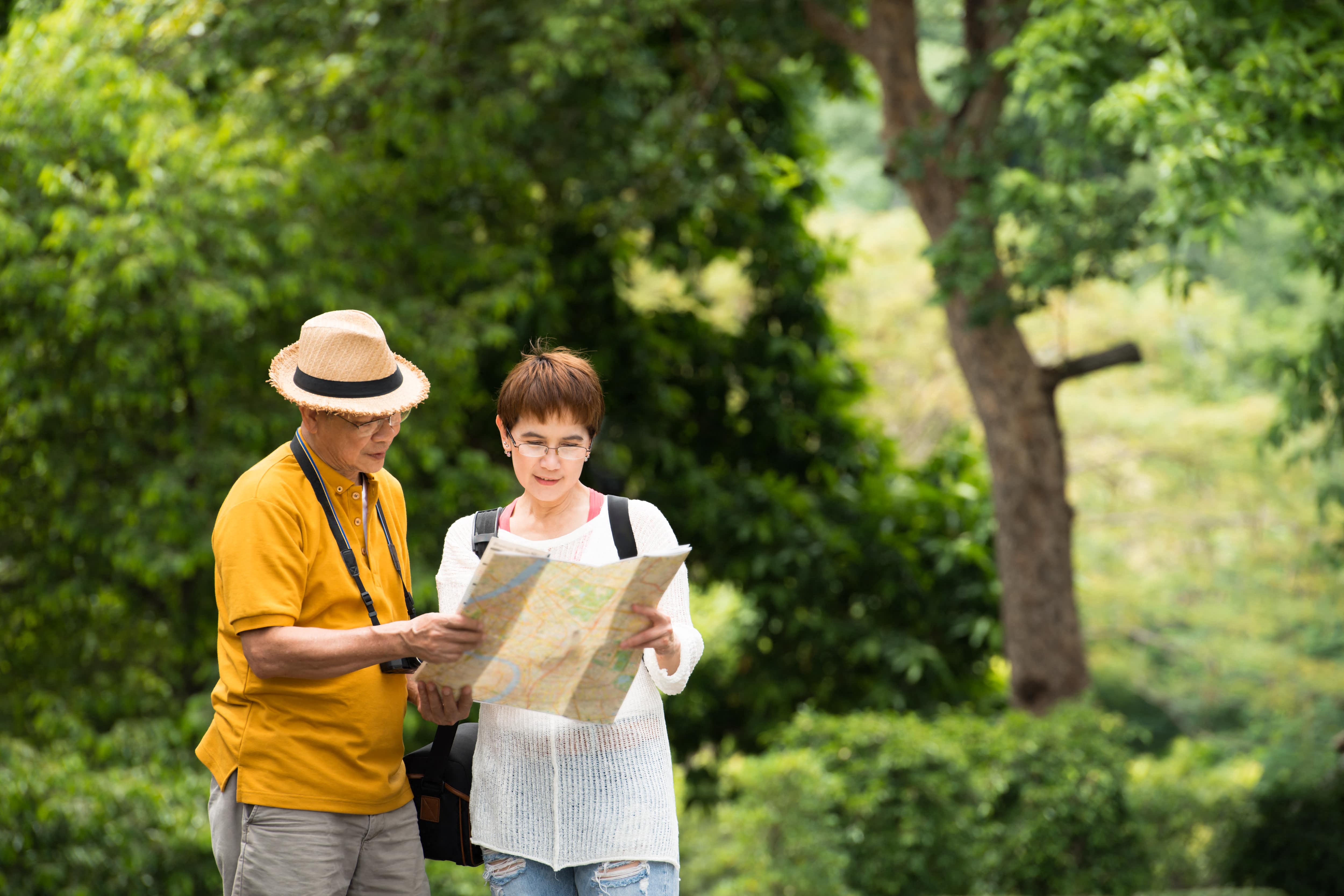 a man and a woman looking at a map