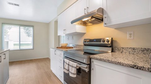 A kitchen with a stove and oven.