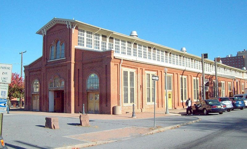 a large brick building on the side of a street