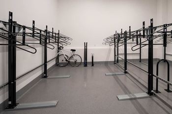 A bicycle is parked in a bike rack at Jayde Parkside Apartments, Washington