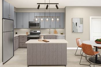 A modern kitchen with a grey island and brown chairs at Jayde Parkside Apartments, Washington, Washington DC