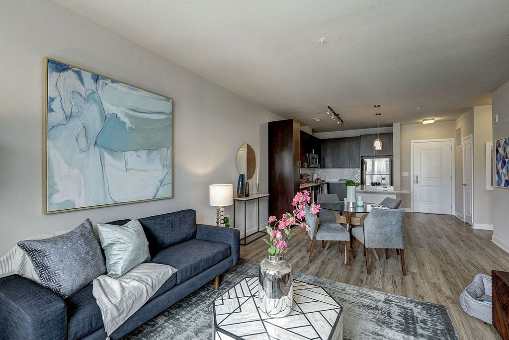 Spacious Living room with a couch and a coffee table at Highgate At The Mile near Tysons, VA