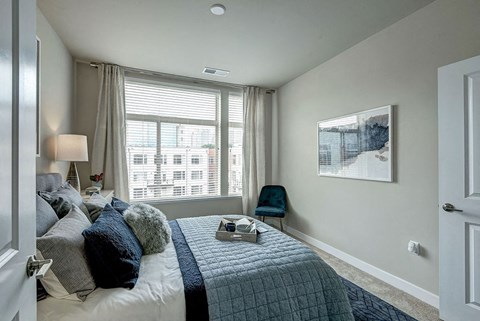 Bedroom with a large window at Highgate at the Mile, McLean Virginia