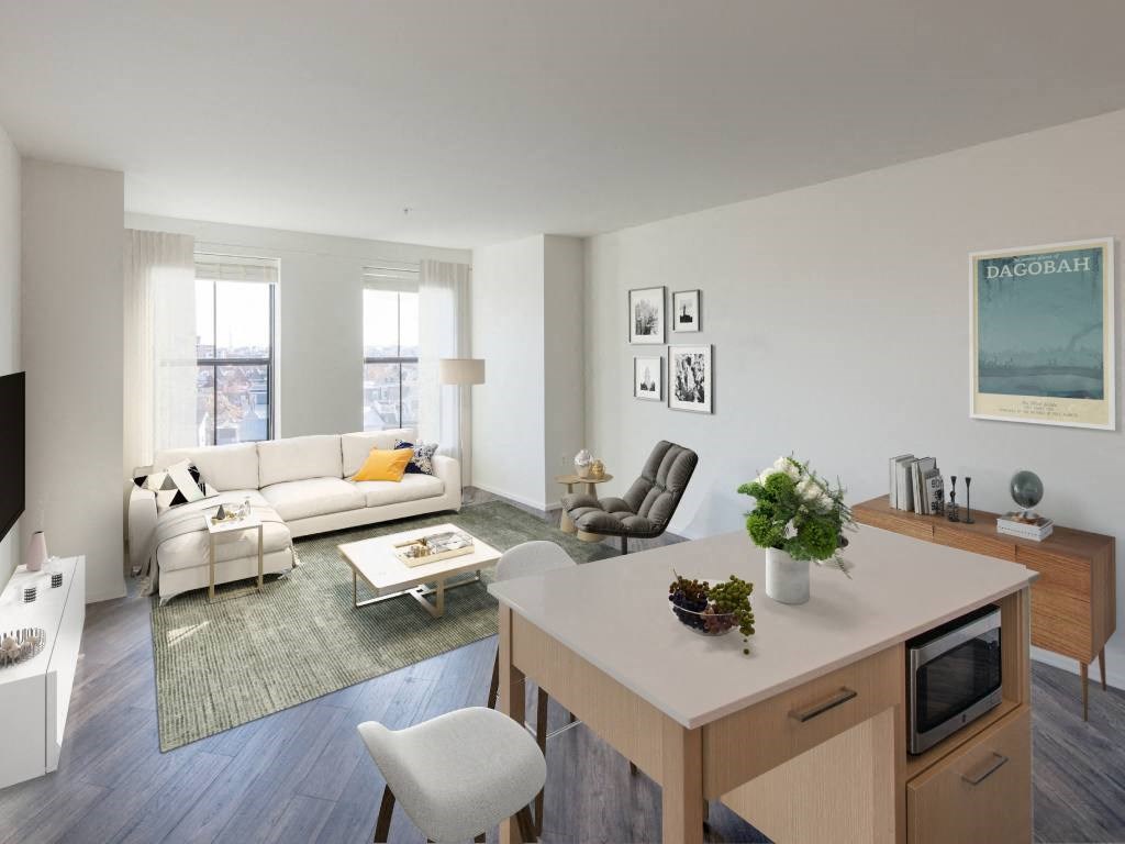 a living room and dining room with a couch and a table