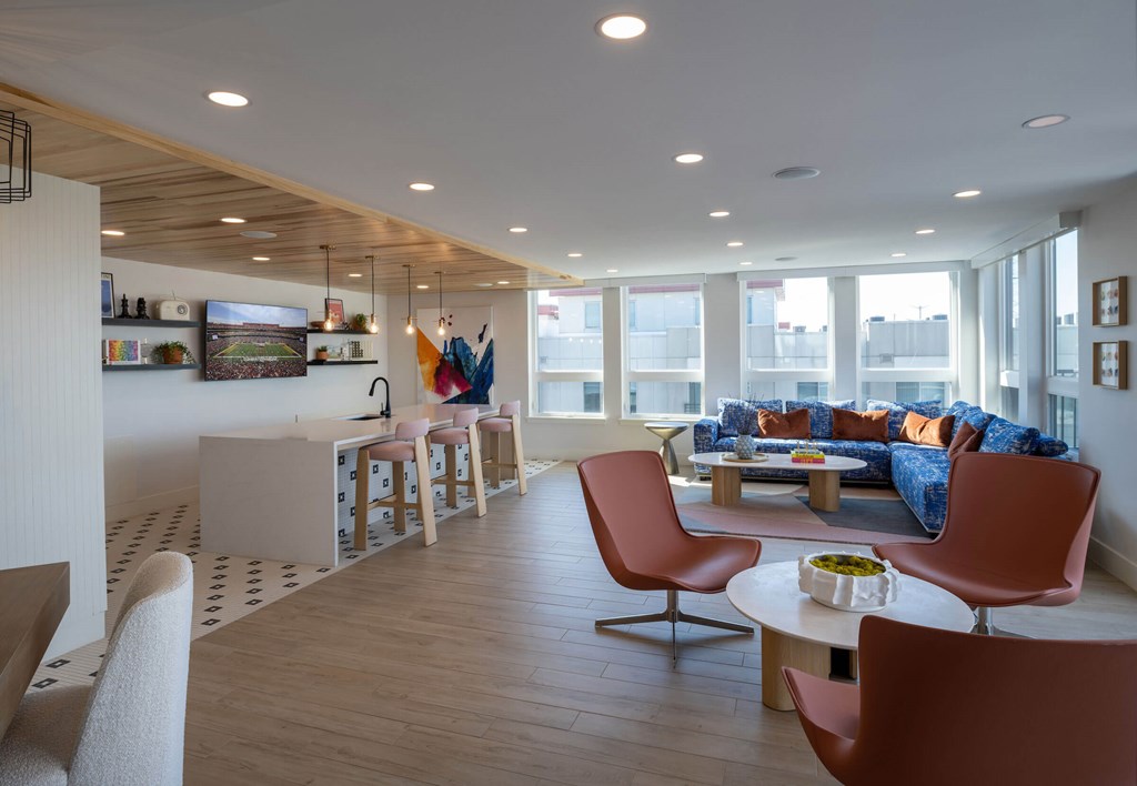 A living room with a white couch and a coffee table at Jayde Parkside Apartments, Washington