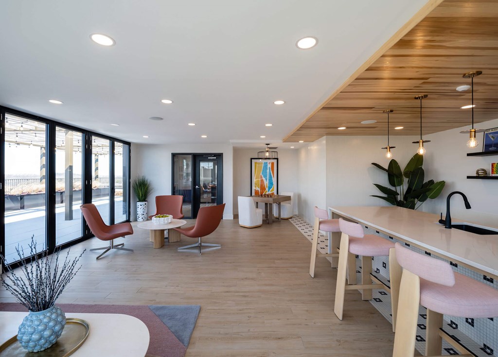 A modern kitchen with a dining area and a living room at Jayde Parkside Apartments, Washington, DC