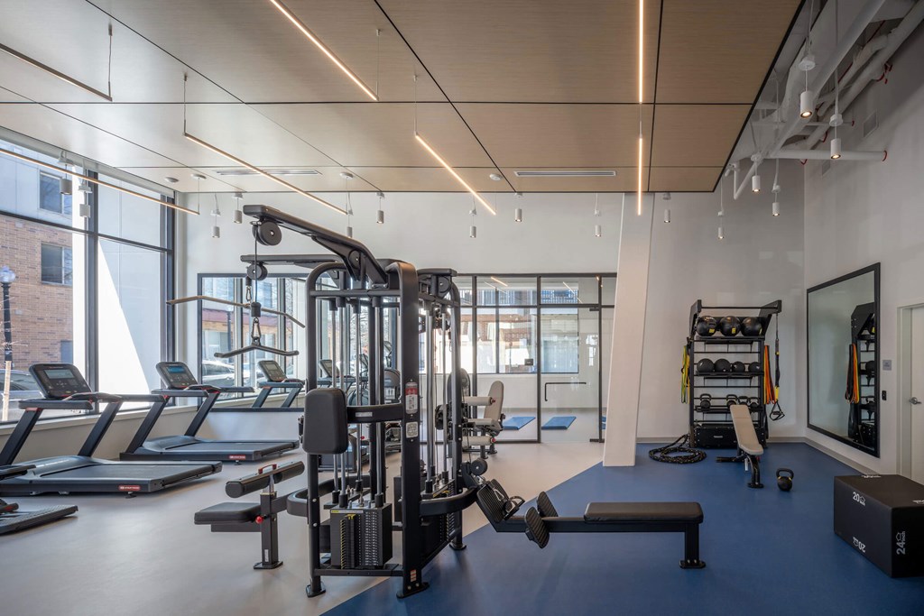 A gym with treadmills, weights, and exercise equipment at Jayde Parkside Apartments, Washington DC, 20019