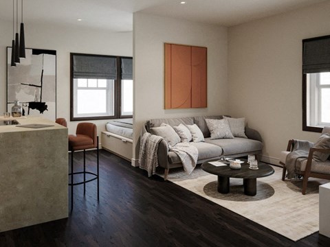 A modern living room with a grey sofa and a wooden coffee table.