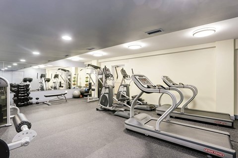 Fitness center with cardio and strength equipment at Tivoli Gardens Apartments, Washington, 20010