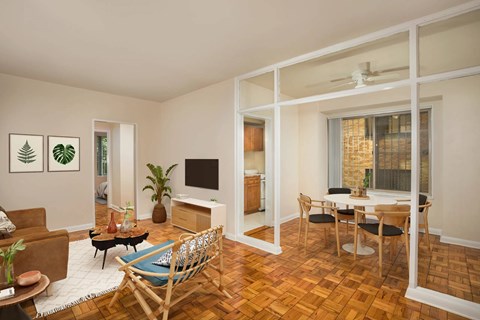 A living room with a brown chair and a brown couch.