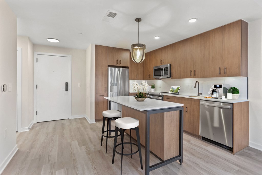 the preserve at ballantyne commons apartment kitchen with island and stainless steel appliances