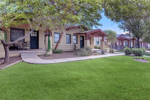 A row of houses with green lawns in front at Roosevelt Commons Apartments, Phoenix, 85003