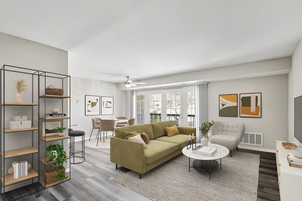 A living room with a green couch and a coffee table at Shenandoah Station Apartments, Triangle, VA, 22172