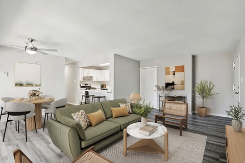 A living room with a green couch and a coffee table.