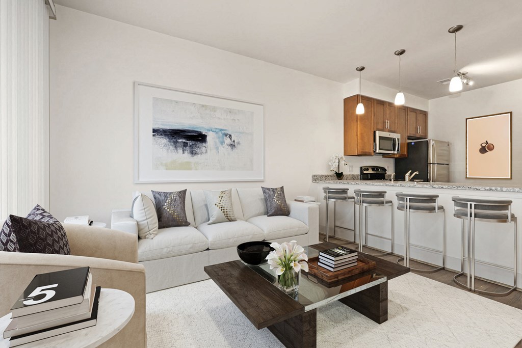 an open living room and kitchen with a couch and table