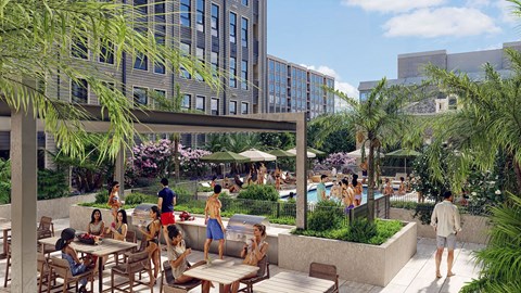 Outdoor pool deck with grilling stations and seating at Vandeveer Apartments, Florida, 32202