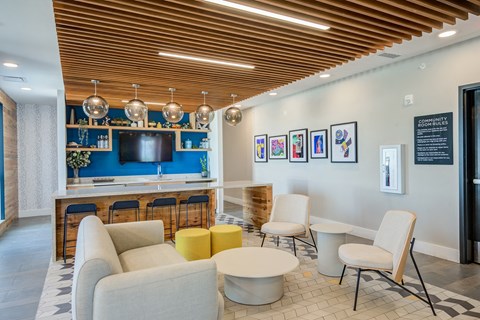 a living room filled with furniture and a flat screen tv