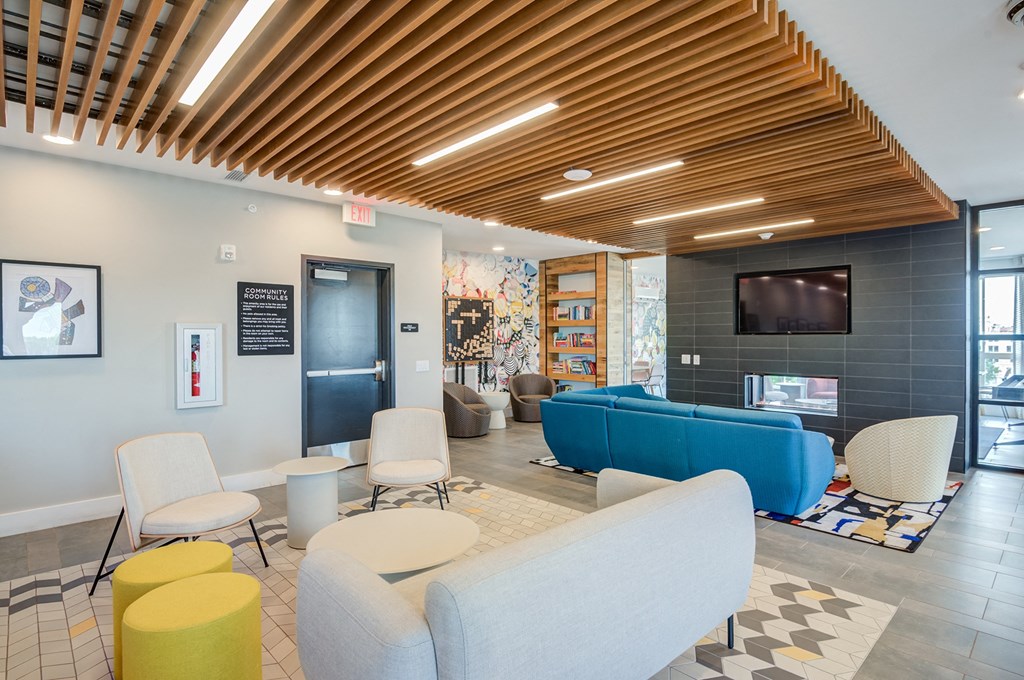 a room with couches chairs and a television at Vesta Parkside, Washington