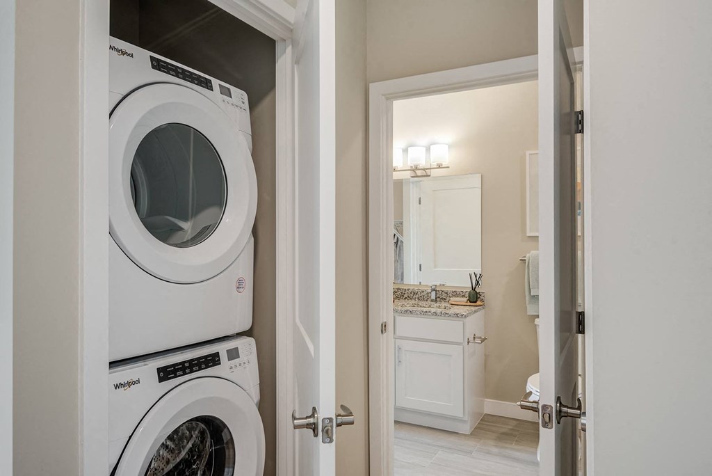 a washer and dryer in a laundry room at Vesta Parkside, Washington