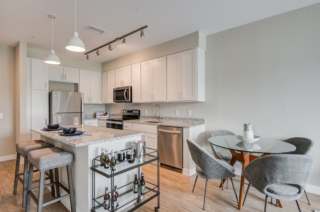 a kitchen and dining area in a 555 waverly unit at Vesta Parkside, Washington, 20019