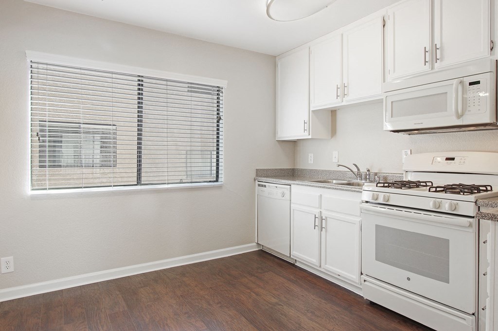 Kitchen With White Cabinetry And Appliances at Superior Place, Northridge, CA