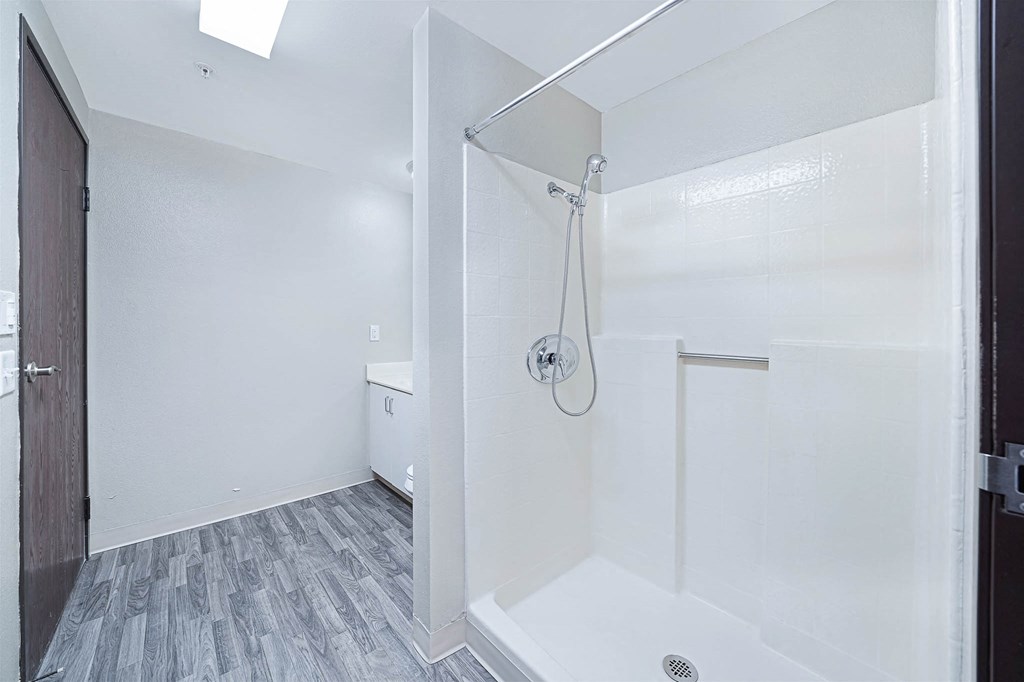 a bathroom with a shower and a toilet in it