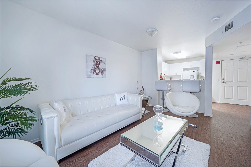 a living room with a white couch and a coffee table