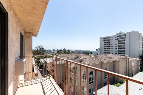 Private balcony with cityscape and apartment views at Joro Properties Apartments, Hollywood, California
