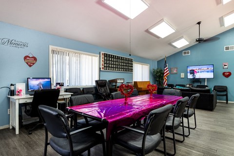 A conference room with a purple table and chairs. at Heritage Park, Rialto, CA 92376