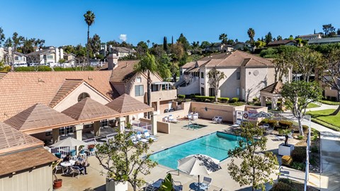 Aerial view showing apartment roof and pool at Whispering Fountains Diamond Bar, Diamond Bar, CA