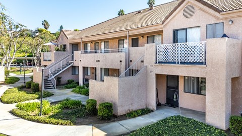 A building with a balcony and a staircase leading to the second floor. at Whispering Fountains Diamond Bar, Diamond Bar, CA 91765