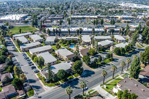 Suburban area with apartment buildings and palm trees at Whispering Fountains Riverside, Riverside, CA, 92503
