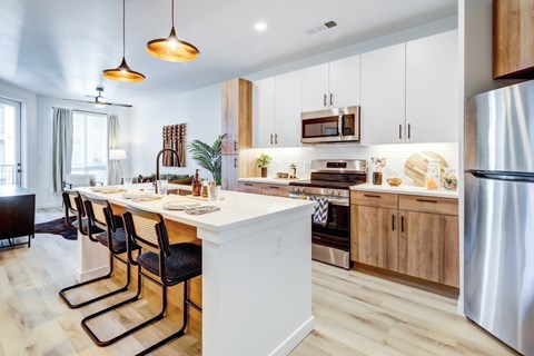 Kitchen with island at Tempo Nine Mile Station in Aurora, Colorado