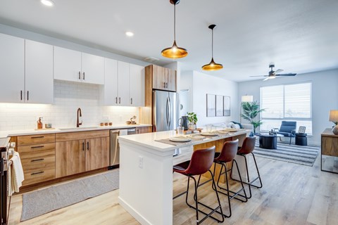 Kitchen with stainless-steel appliances at Tempo Nine Mile Station in Aurora, Colorado
