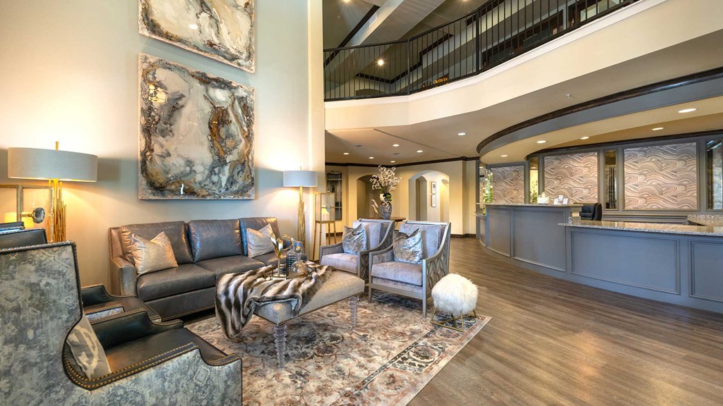 The lobby at Bell Tower Reserve with a sitting area to the left and the office desk to the right.