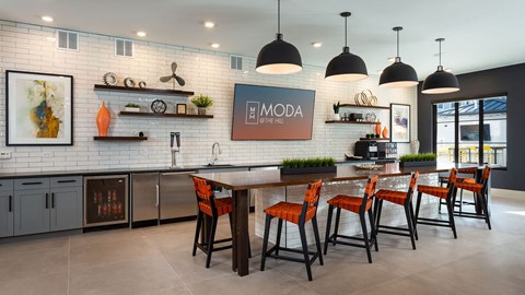 a large kitchen with a large table and chairs