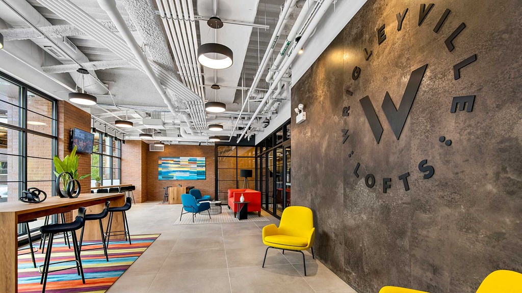 The Wrigleyville Lofts logo wall is on the right with the rest of the main lobby going off to the left.